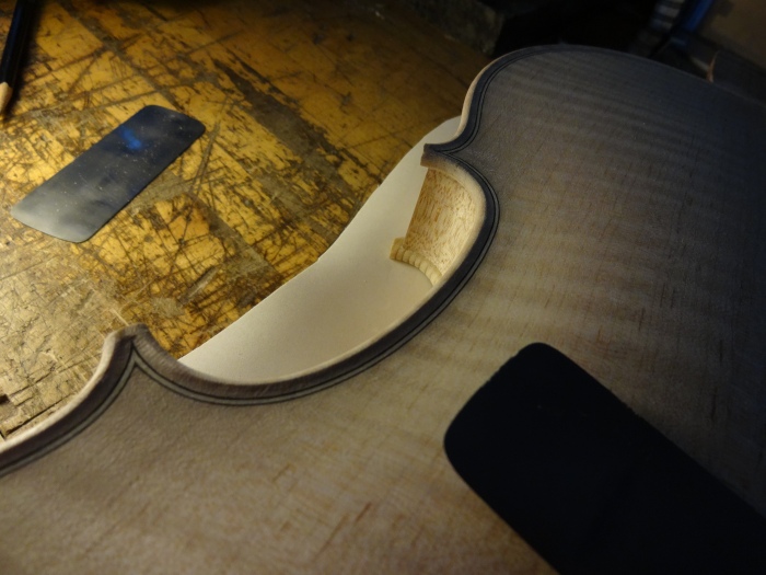 sharpening violin edges with scraper